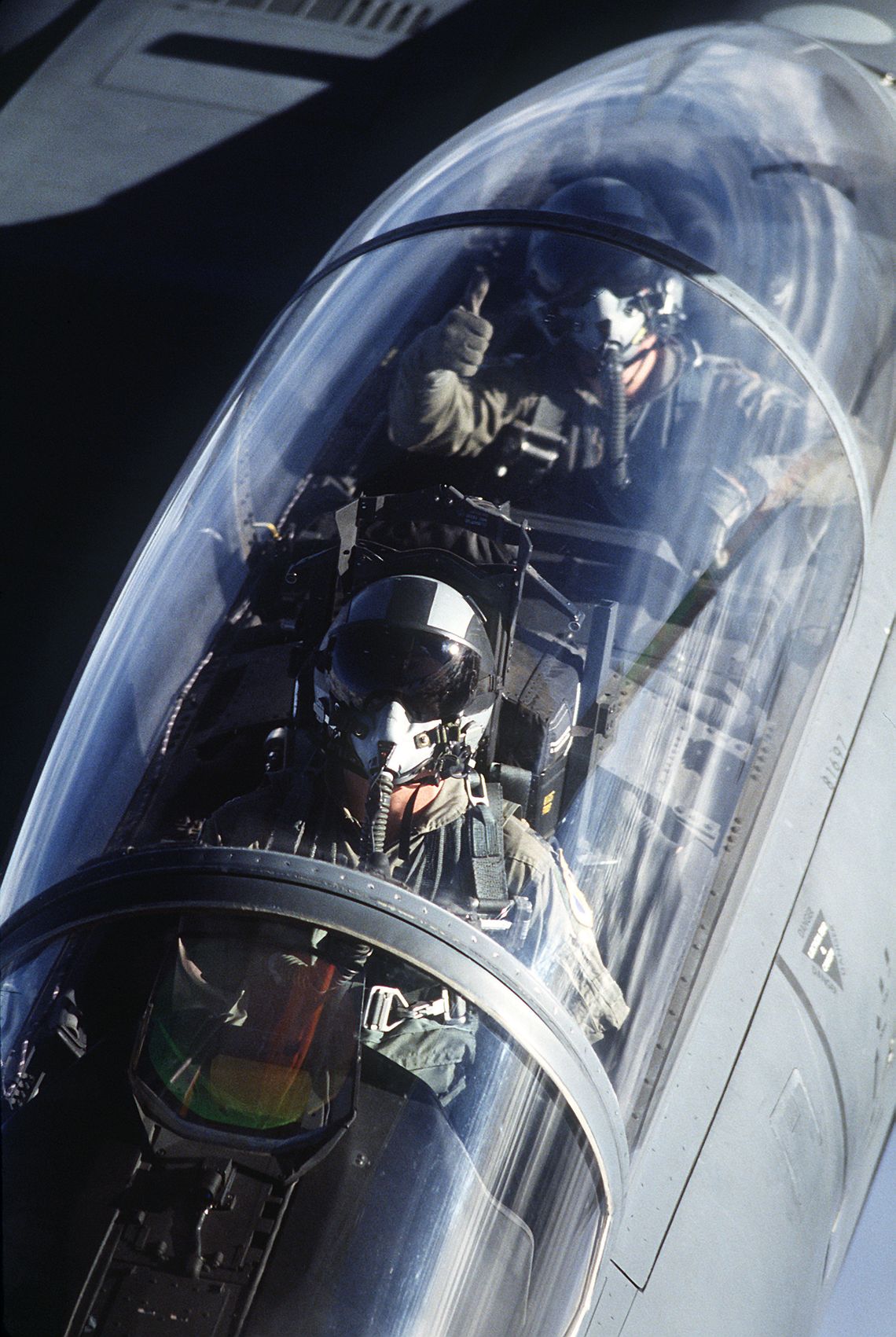 F-15E cockpit view from tanker; pilot and WSO visible