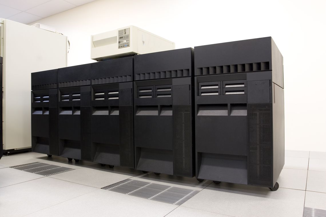 A lineup of IBM AS400 server machines in a Data Centre.