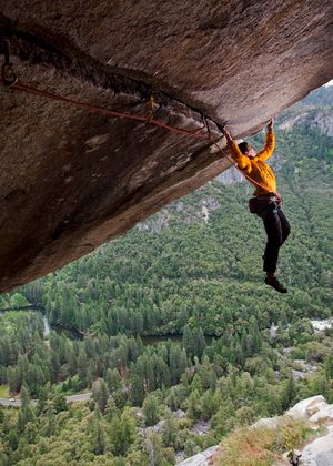 Alex Honnold climbing on Separate Reality, a difficult over hanging roof crack in Yosemite National Park, California